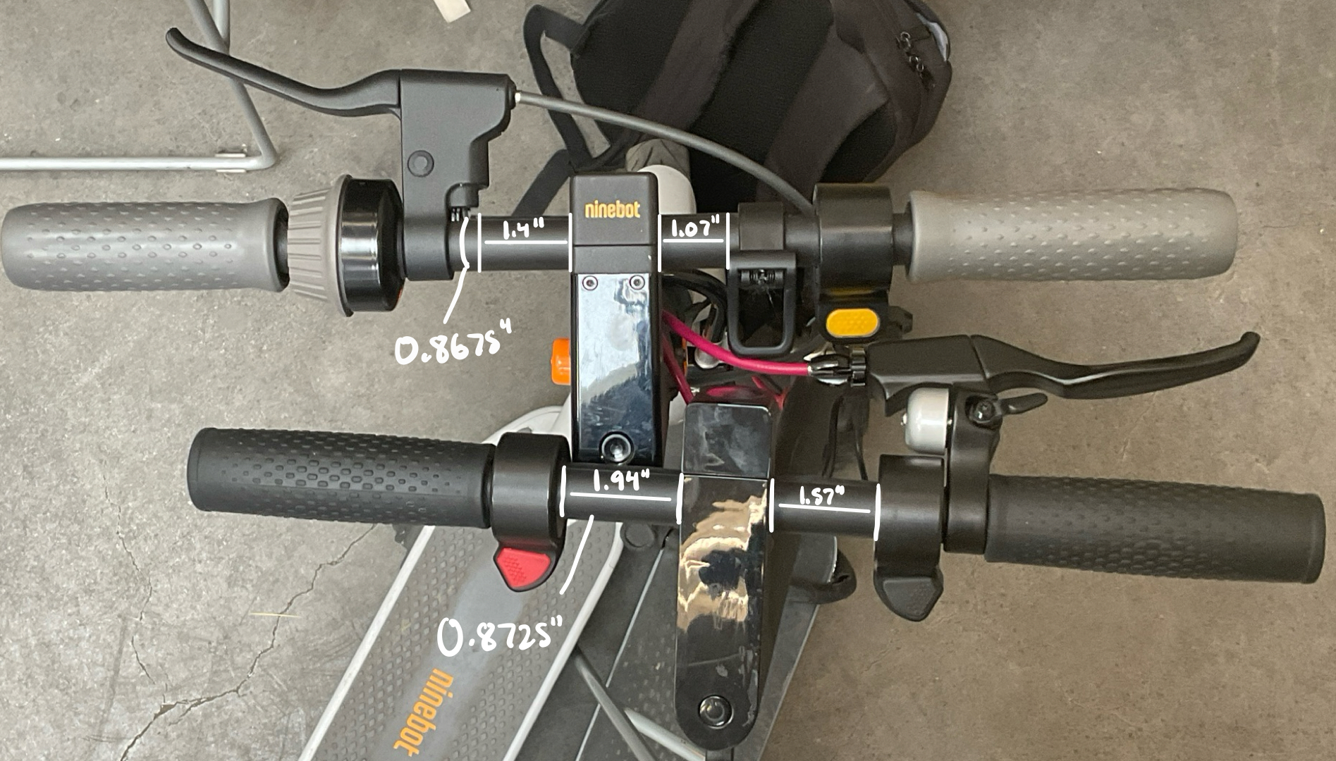 Photograph of the e-scooter handlebar annotated with real-world dimensions