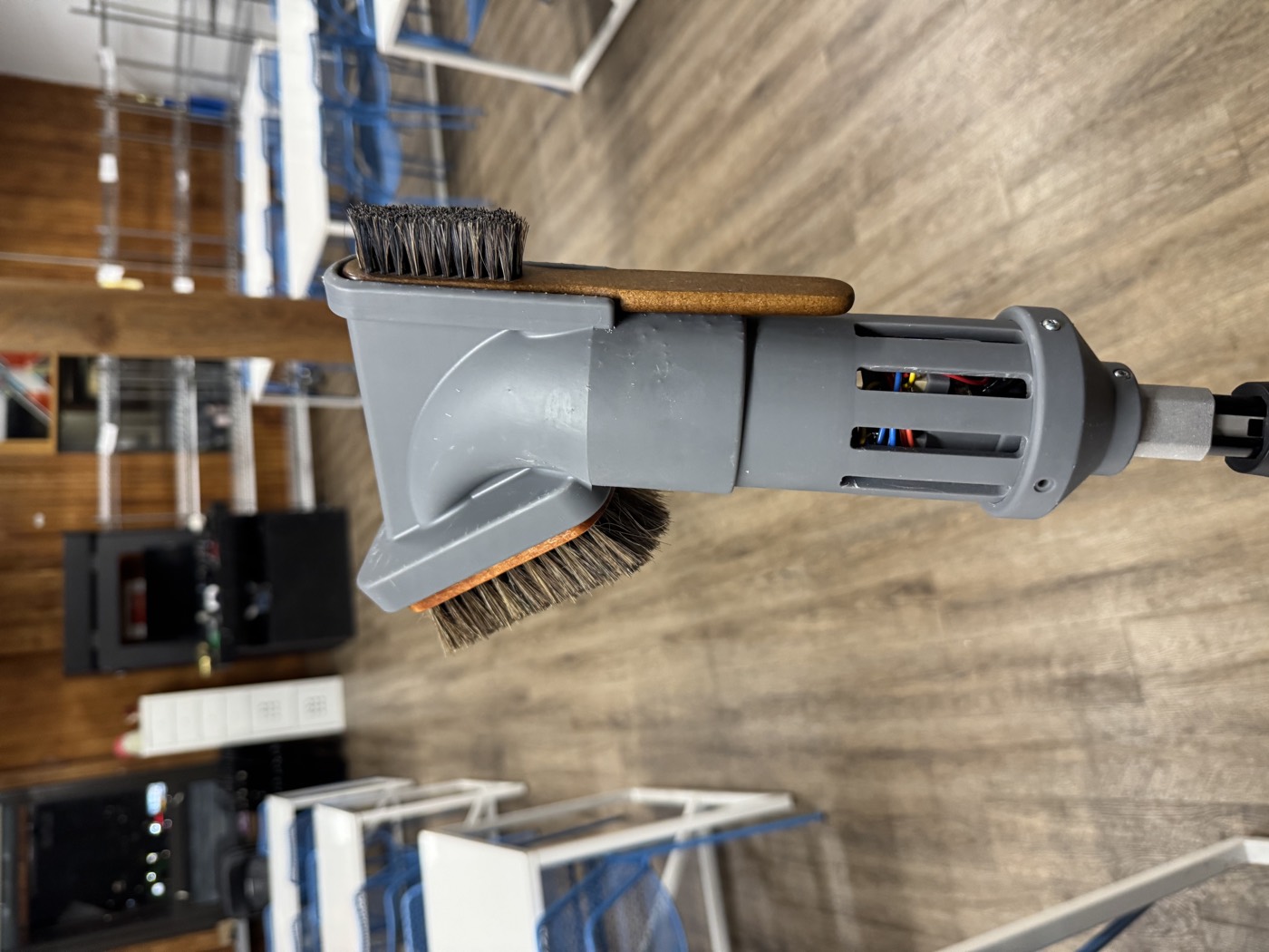 Final prototype of the fan-powered climbing brush mounted on an extendable pole